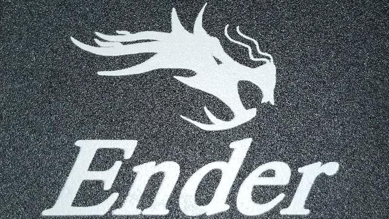 The Ender logo to represent the best 3d printer for beginners. The logo consists of a dragon's head above the text 'Ender'.