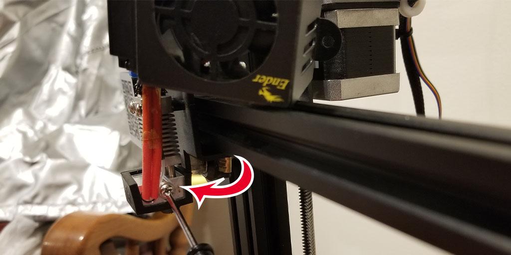 Continue fixing the Ender 3 Pro Thermal Runaway error by carefully ensuring the thermistor set-screw is barely snug, as shown with the red arrow pointing to the screw.