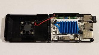 A Le Potato case opened up showing the board itself along with the fan connected to the Le Potato