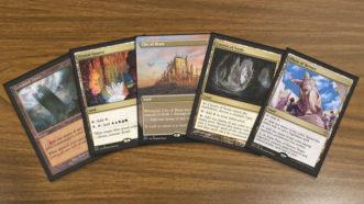 A few of the best MTG 5 color lands being displayed. Cards are Command Tower, Crystal Quarry, City of Brass, Cavern of Souls and Plaza of Heroes