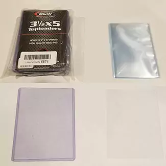 MTG oversized sleeves and top loaders. Showing all sleeves and top loaders and then showing a single top loader and a single sleeve to act as my Planechase sleeves.