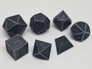 One of the basic and best MTG accessories are dice. Shown here is a set of D&D metal dice. Including a d4, d6, d8, d10, d12 & a d20
