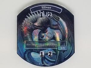 A really cool MTG 3D print project is a creating some Mass MTG Tokens. Shown here is a fully assembled token with a Sliver label.