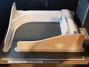 A sample PETG print being shown using the recommended Bambu Lab X1 Carbon PETG settings. The print itself are two feet for a expandable photo studio.