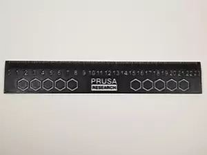 One of the most handy 3D printed tools for Americans is a metric ruler. Shown in the photo is a metric ruler printed in black and white PETG.