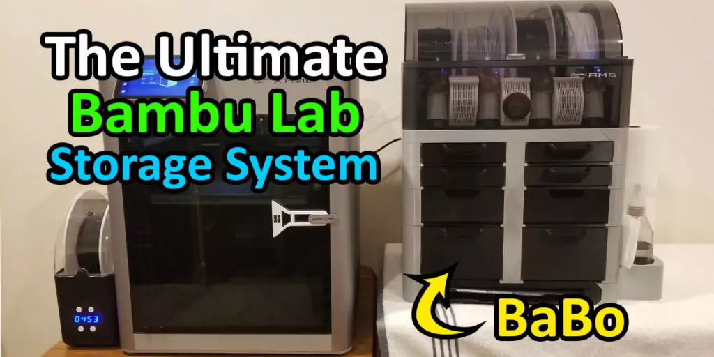 Shown in the photo is a Bambu Lab X1 Carbon with one of the best Bambu Lab storage box solutions, the BaBo system, sitting beneath the AMS. The text 'The Ultimate Bambu Lab Storage System' and 'BaBo' with a yellow arrow are over the image.