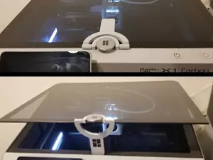 Easily one of the most unique Bambu Lab X1 Carbon upgrades, the print-in-place lid riser. Shown here is the glass riser attached to the X1C's lid handle showing the lid both completely closed and the lid propped open with the riser.