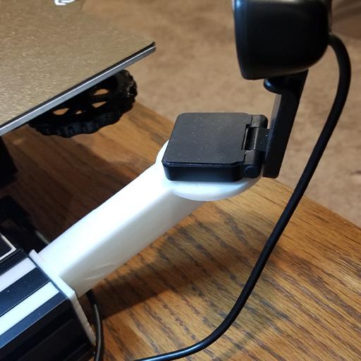 Shown in this photo is one of the Ender 3 upgrades for OctoPrint. It is a camera mount for a USB camera connected to OctoPrint to remotely monitor your Ender 3. The mount is mounted on the front left side of the Ender 3's frame.