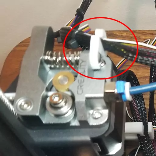 Shown in this photo is a hotend cable clip for the all metal extruder installed on an Ender 3 Pro. This is one of the many cable management Ender 3 upgrades you can make to keep your printer's cables all tidy.
