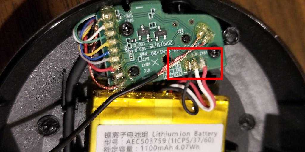 Shown in this photo is a close up of the wiring inside the headset. The second step to replacing the Arctis 1 battery is to open the shell and expose the wiring. The battery's 3 wires that are soldered to the board are highlighted in red.