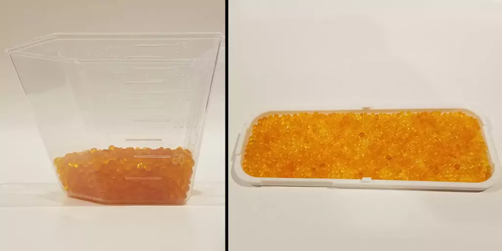 Image shows step 2 of the build process for the DIY filament storage dry box by measuring and pouring silica beads into the tray part.